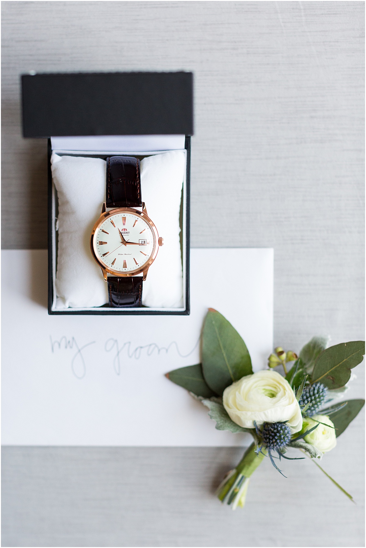 Men's watch with letter addressed to my groom and white and blue thistle boutonniere