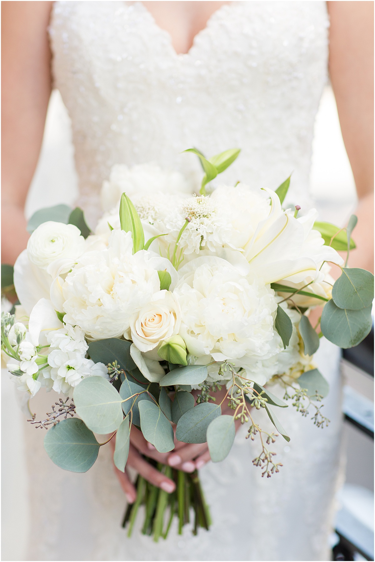 white bridal bouquet with roses peonies and greenery